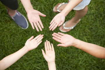 Friends putting hands together