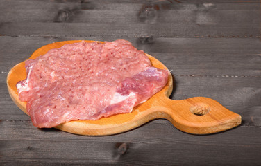 Big piece of crude pork for a chop