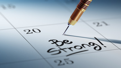 Concept image of a Calendar with a golden dart stick.. The words