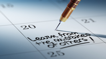 Obraz premium Concept image of a Calendar with a golden dart stick.. The words