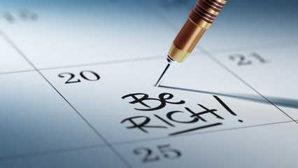 Concept image of a Calendar with a golden dart stick.. The words