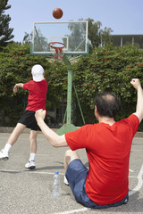 Father And Son Playing Basketball