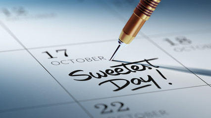 Concept image of a Calendar with a golden dart stick.. The words