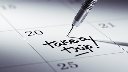 Fototapeta premium Concept image of a Calendar with a golden dart stick.. The words