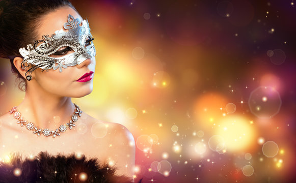 Elegance Woman Wearing Carnival Mask With Golden Stardust

