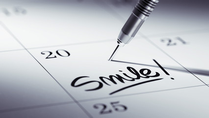 Concept image of a Calendar with a golden dart stick.. The words