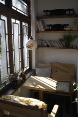 Obraz na płótnie Canvas Table And Chair Next To A Window In A House