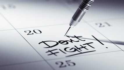 Concept image of a Calendar with a golden dart stick.. The words