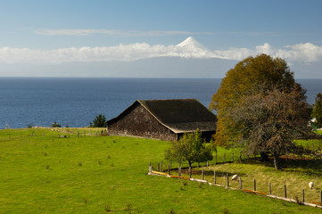 Old Wooden Barn with view over Osorno Volcano, Puerto Varas, Chi