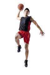 Man jumping to shoot basketball