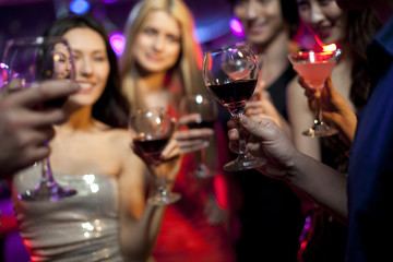 Stylish young people drinking in bar