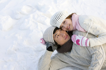 Young couple embracing in the snow