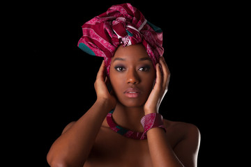Young beautiful african woman wearing a traditional headscarf
