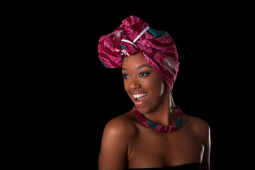 Young beautiful african woman wearing a traditional headscarf