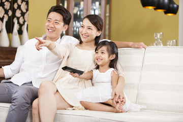 Happy family watching TV