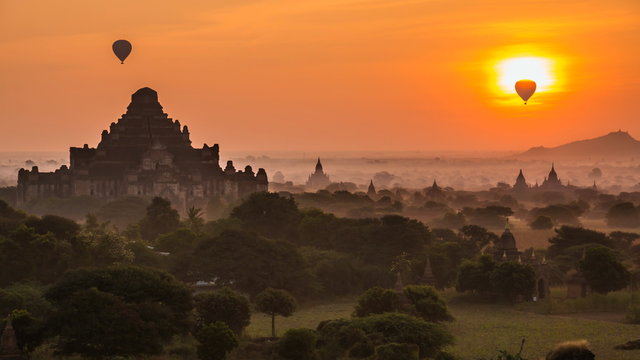 Ancient Empire Bagan Of Myanmar (Burma) And Balloons On Sunrise (tilt up)