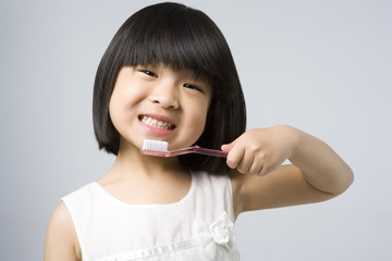 Little girl brushing teeth