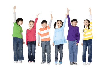 Obraz premium A group of children holding their hands in the air
