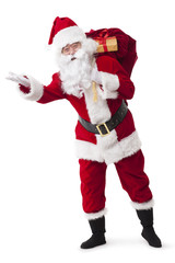Santa Claus carrying sack of gifts and waving