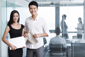 Happy business people with laptop