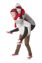 Lovely young couple doing piggyback in Chinese New Year