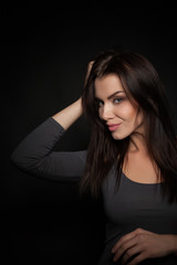 Portrait of a Beautiful Woman Model black background studio - Stock Image