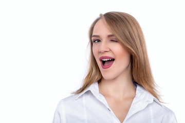 Winking Young Beautiful Woman isolated on white background - Stock Image