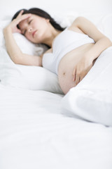 Fototapeta na wymiar Pregnant woman sleeping
