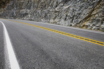 Naklejka premium Road going through the mountains