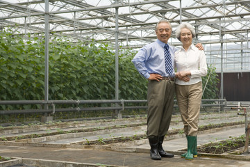 Senior couple in modern farm