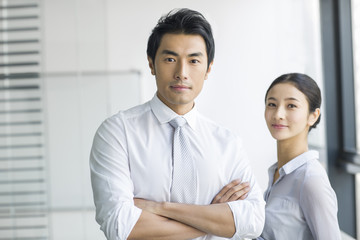 Portrait of young businessman and businesswoman
