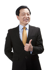Senior businessman doing thumbs-up