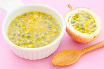 Maracuja, passion fruit in white bowl.
