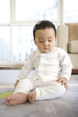 Infant on floor with bubbles