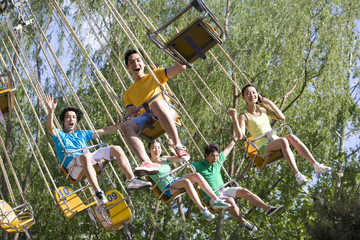 Young people having fun at the amusement park