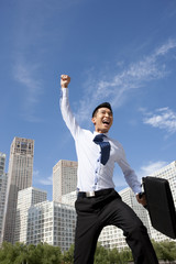 Excited Businessman Jumping