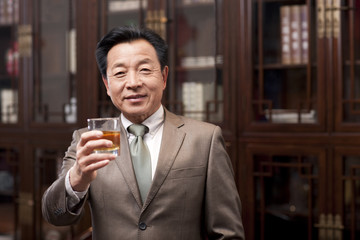 Successful businessman toasting