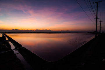 Beautiful landscape of Light sunset at sea salt farm 