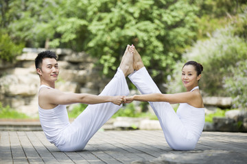 Young couple doing yoga