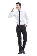 Young businessman drinking water