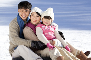 Fototapeta premium Family having fun in snow