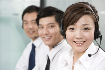 Office workers with headsets