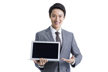 Young businessman presenting laptop