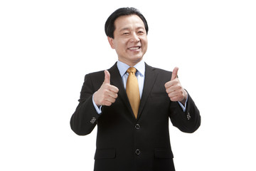 Senior businessman doing thumbs-up