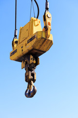 Fototapeta premium Crane hook at port area and blue sky