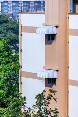 Rainproof awning of slide window on sunny day. © Eakkaluk