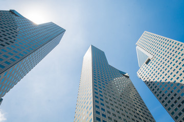 Fototapeta na wymiar Skyscraper building at singapore - bright light processing style