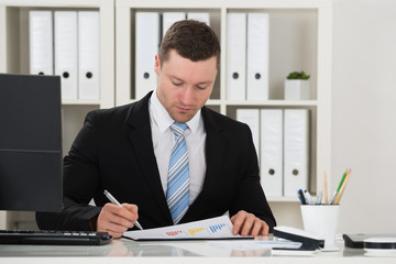 Fototapeta premium Businessman Analyzing Financial Charts
