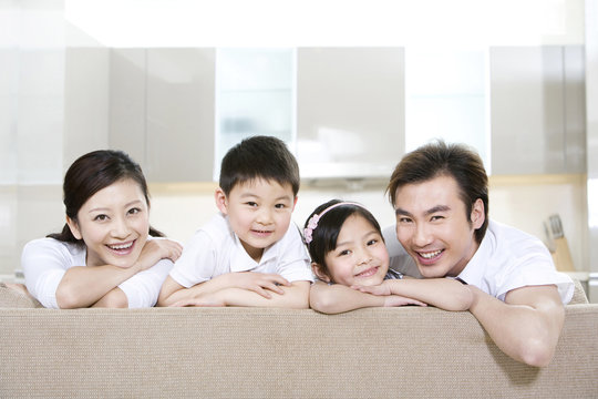 Portrait of a young family at home