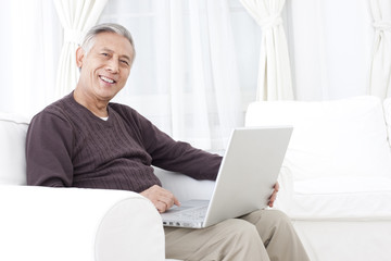 Senior man using laptop